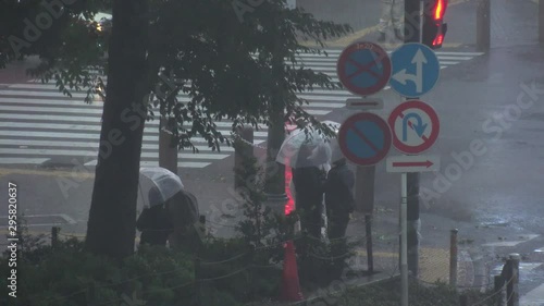 TOKYO,JAPAN - 12 OCTOBER 2019 : Powerful Typhoon Hagibis made landfall. Heaviest rain and winds in 60 years. Government issued highest level of disaster warning. View around Shibuya scramble crossing. photo