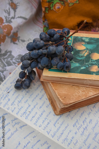 blue grapes on an old book