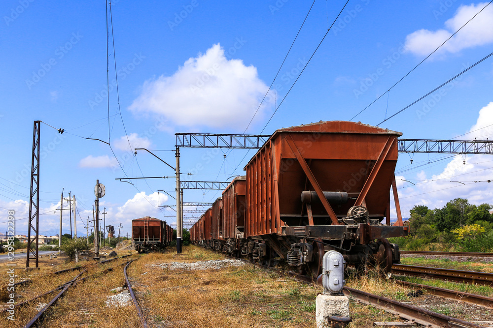 Railway road and old freight cars on background. Railway road and old freight cars on background.