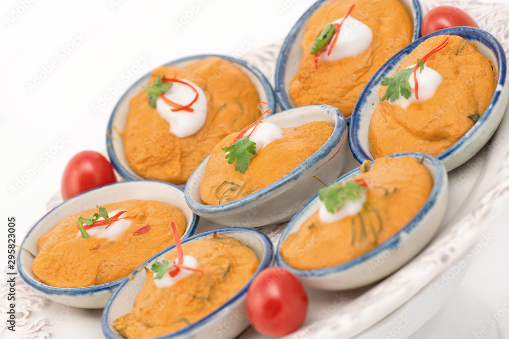 steamed fish with curry paste with white background. steamed fish with curry paste with white background.