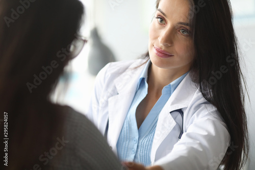 Adult caucasian doctor is sympathetic to patient.