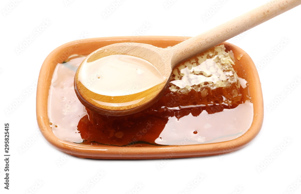 Honeycomb covered with honey isolated on white background Honeycomb covered with honey isolated on white background