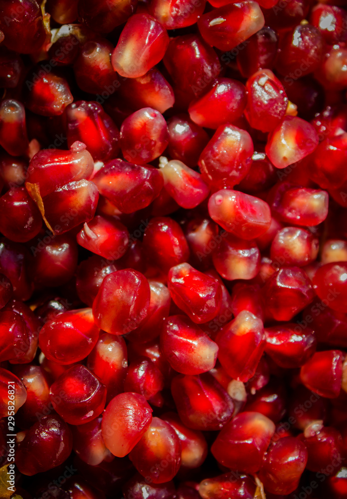 Punica granatum grains on a plate. Background of berries. Punica granatum grains on a plate. Background of berries.