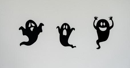 Table top view aerial image of decoration Happy Halloween day background concept.Flat lay accessories essential object to party the black ghost on rustic white stone.Space for creative design text.