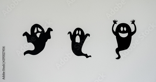 Table top view aerial image of decoration Happy Halloween day background concept.Flat lay accessories essential object to party the black ghost on rustic white stone.Space for creative design text.