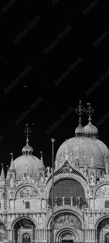 Partial view of St Mark Basilica in Venice, built in byzantine and gothic style in the Middle Ages (Black and White with copy space above)