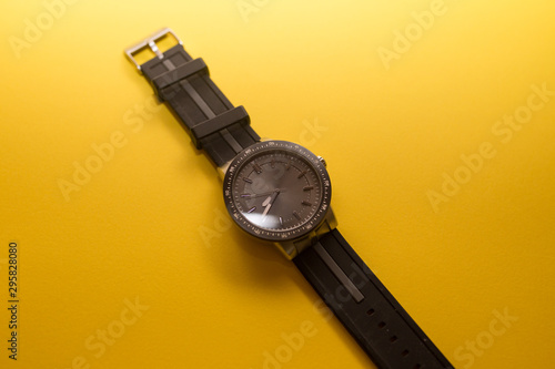 black watch on a yellow background