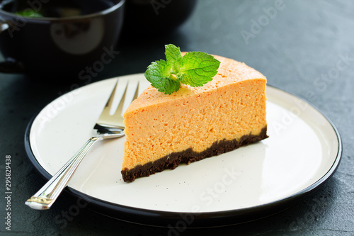 Pumpkin cheesecake with raspberries. Selective focus.