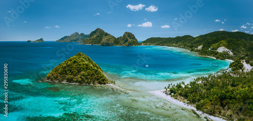 Palawan, Philippines. Las Cabanas beach with rocky mountains and village El Nido in background © Igor Tichonow