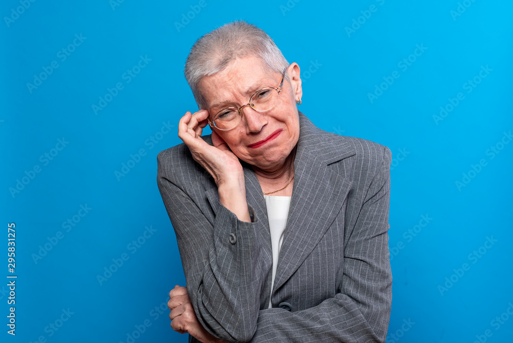 Old business lady crying, looking worried and sad Old business lady crying, looking worried and sad