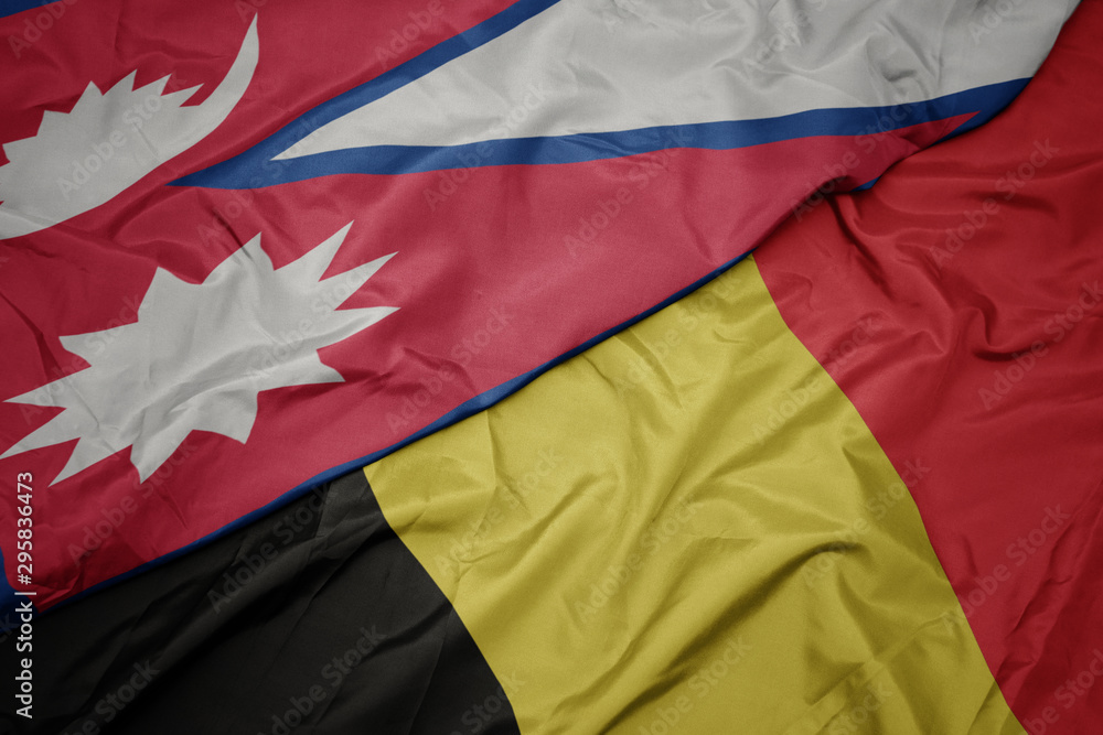 waving colorful flag of belgium and national flag of nepal. waving colorful flag of belgium and national flag of nepal.