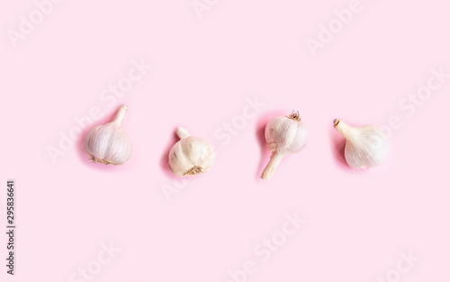 Flat lay composition with fresh garlic on light background