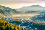 Beautiful scenery landscape Romania Magura Pestera village mountains hills fields foggy morning