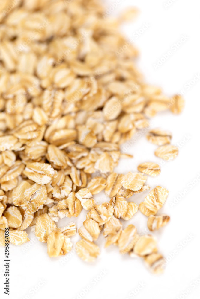 Heap of whole organic oats isolated on white background Heap of whole organic oats isolated on white background
