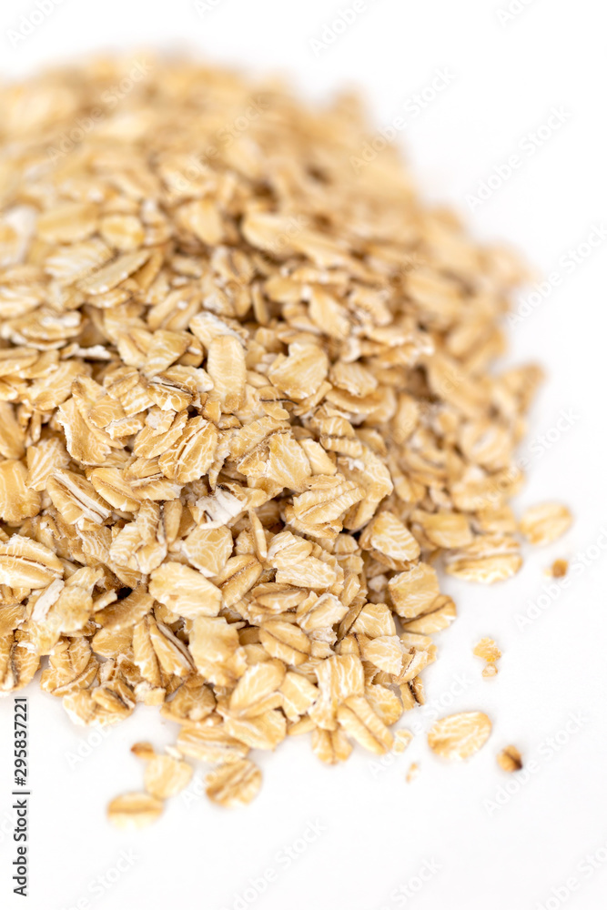 Heap of whole organic oats isolated on white background Heap of whole organic oats isolated on white background