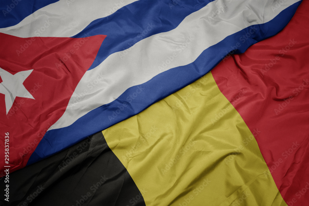 waving colorful flag of belgium and national flag of cuba. waving colorful flag of belgium and national flag of cuba.