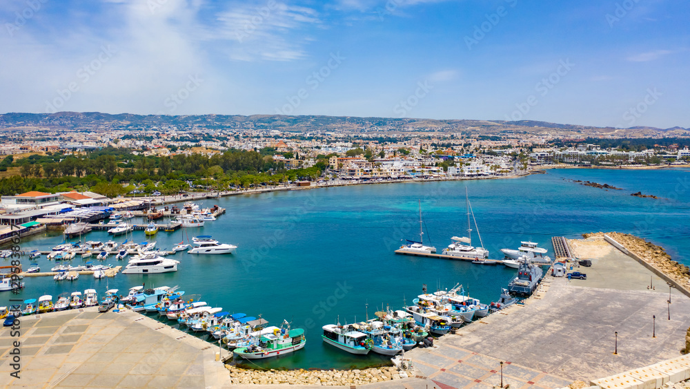 Cyprus. Pathos. Panorama of the Mediterranean coast from a height. Boat Harbor. Pleasure and fishing boats at the pier. Boat trips in the Mediterranean sea.
