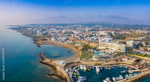 Cyprus. Protaras. The Port Of Paralimni. Pernera. Panorama of the Mediterranean coast from a height. Top view of kalamies beach. Church of St. Nicholas in Cyprus. Cyprus beach resort. Boat Harbor.