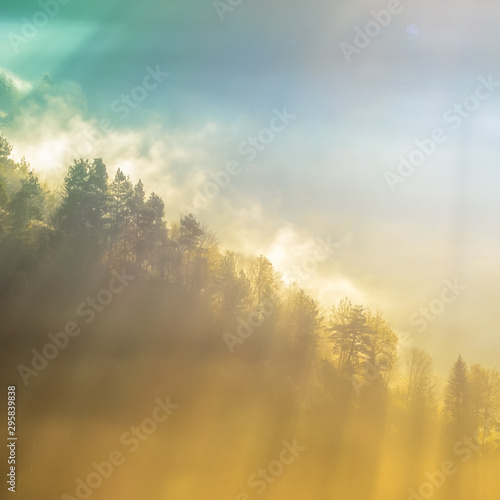 Beautiful scenery landscape Romania village mountains hills fields foggy morning first ray splitting light