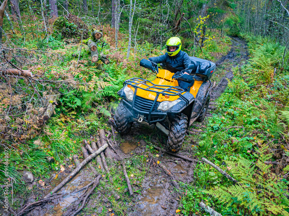 Riding an ATV. Quadricycle. Quad bike Off road ATV ride. A man