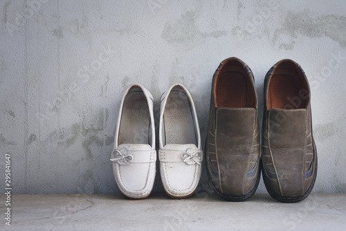 Man and woman shoes over grunge background (Vintage style colors)