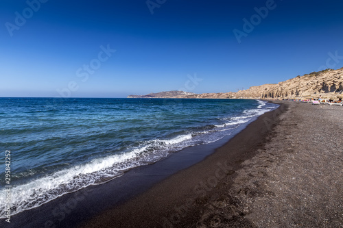 Coast of beach with black volkanic sand on a summer. photo