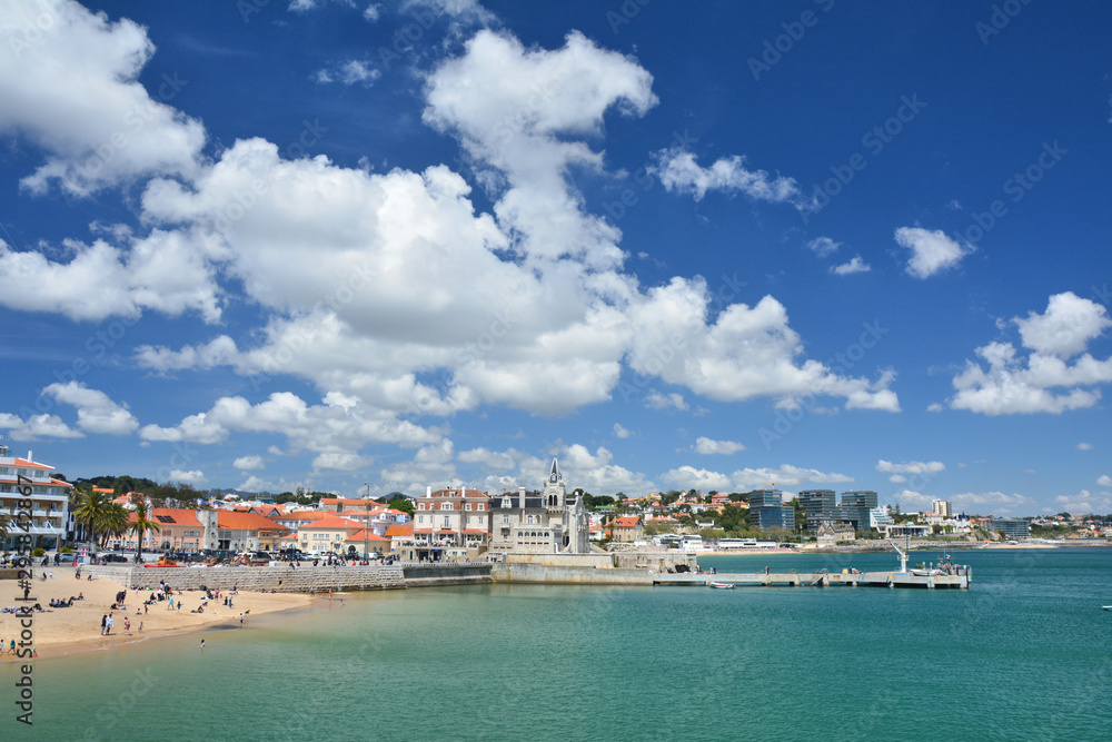 The pier and beach on sunny day in Cascais, Portugal.
