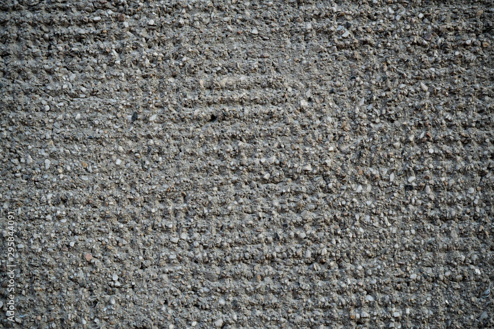 Texture of an old cracked concrete wall. Background image of a worn gray concrete surface Texture of an old cracked concrete wall. Background image of a worn gray concrete surface