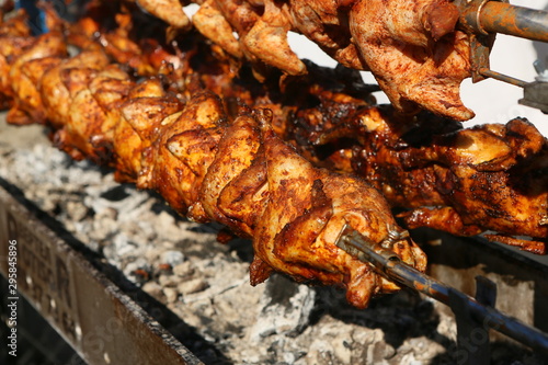 Mixed grilled meat platter. Assorted delicious grilled meat. The closeup of some meat skewers being grilled in a barbecue. grilled meat skewers, barbecue.