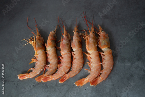 Raw red prawns on a gray background photo