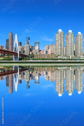 Modern city financial district buildings and reflections in the water Chongqing China.