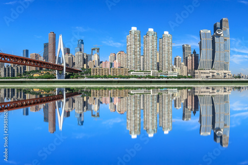 Modern city financial district buildings and reflections in the water,Chongqing,China. © ABCDstock