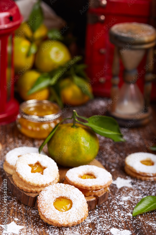 Linzer Christmas cookies with tangerine jam and sugar powder. Delicious biscuits. Sweet dessert Linzer Christmas cookies with tangerine jam and sugar powder. Delicious biscuits. Sweet dessert