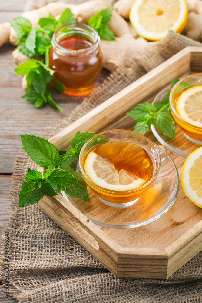 Ginger tea with lemon, mint and honey for flu cold Ginger tea with lemon, mint and honey for flu cold