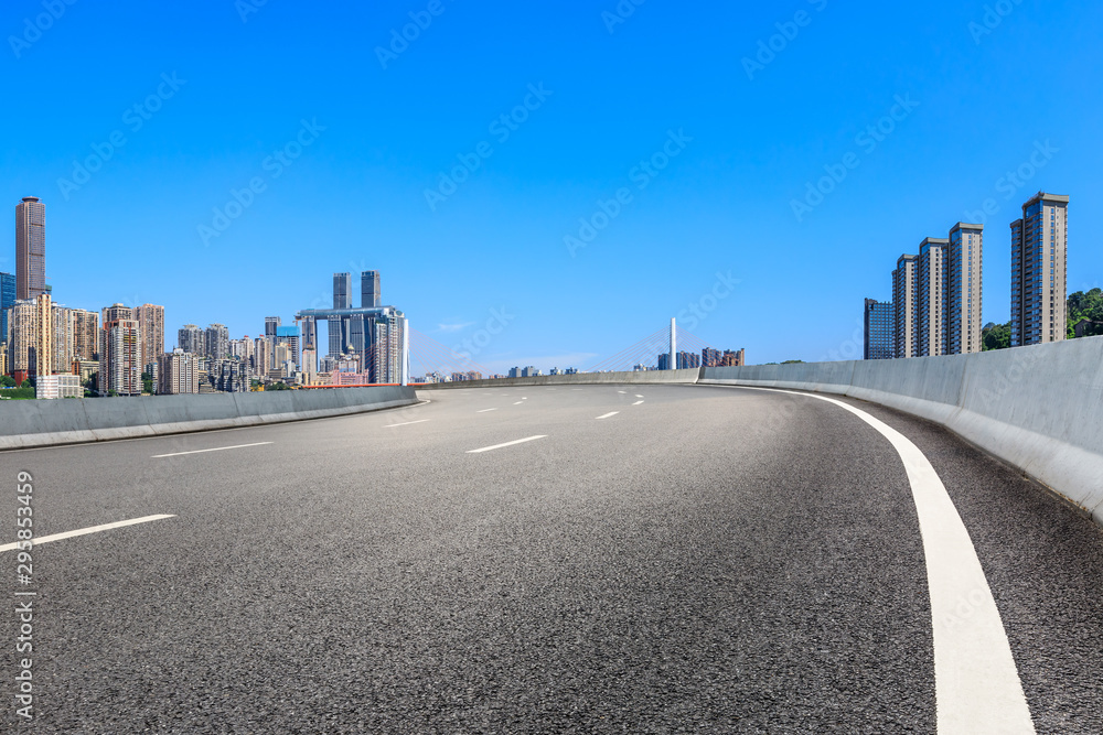 Empty asphalt highway and modern city financial district in chongqing,China.
