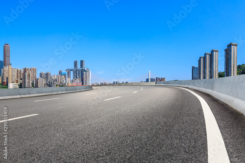 Empty asphalt highway and modern city financial district in chongqing China.