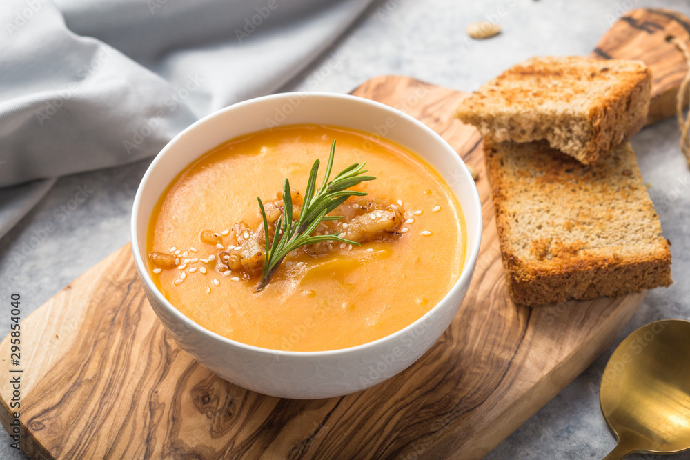Homemade Autumn Butternut Squash pumpkin cream Soup with Bread and seeds. top view Homemade Autumn Butternut Squash pumpkin cream Soup with Bread and seeds. top view