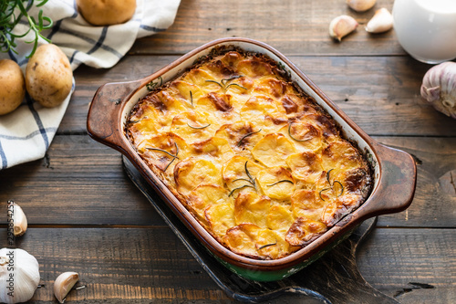 Potato casserole with garlic and rosemary photo