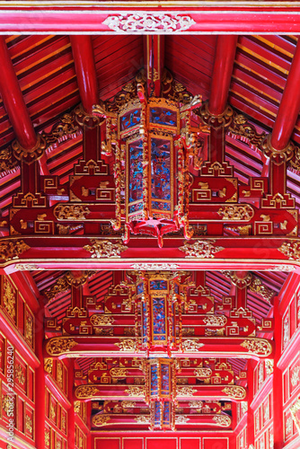 Amazing ornate ceiling in red colors in the corridor between buildings in Purple Forbidden city (Imperial Citadel) in Hue, Vietnam © Dennis Gross