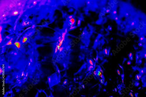 Beautiful abstract texture black purple and blue bubbles and colorful bubble background in water on darkness purple background pattern clear soapy shiny