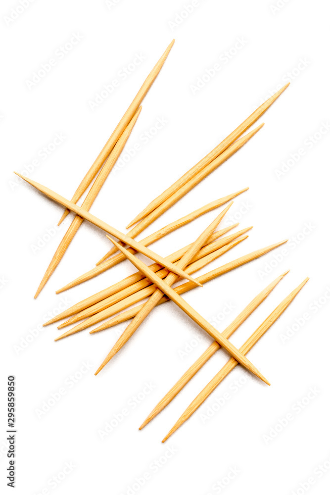 Wooden sticks for cleaning teeth isolated on a white background. Wooden sticks for cleaning teeth isolated on a white background.