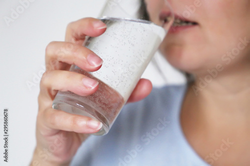 Woman drinking clean water, glass in female hands close-up, selective focus. Concept of thirst, diet, water purification, mineral drink, skin care
