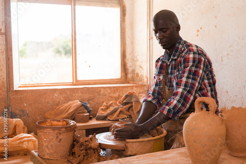 Man making ceramics on pottery wheel