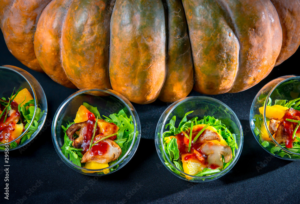 Baked pumpkin with arugula and porcini mushrooms with wild cranberry sauce