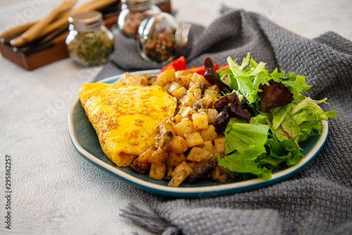 French Omelette with Potatoes, Mushroom and Salad