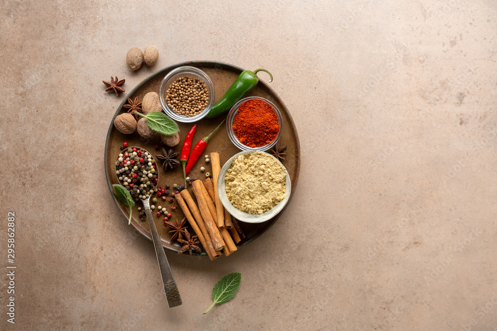 Composition of Spices and seasonings on plate top view Composition of Spices and seasonings on plate top view