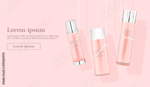Cosmetic products hanging by ropes on pink background