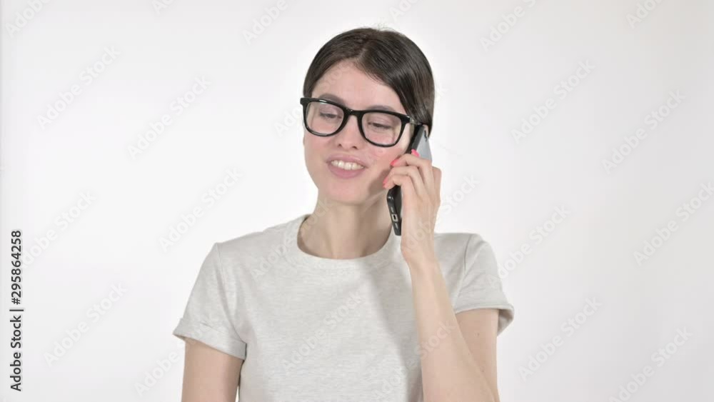 Young Woman speaking on the Phone on White Background Young Woman speaking on the Phone on White Background