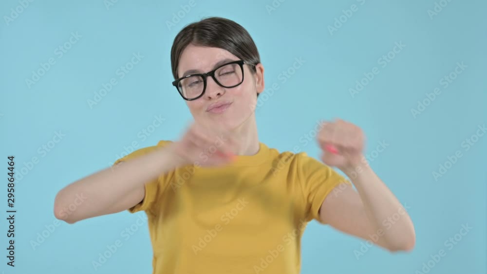 Happy Young Woman Dancing and Enjoying on Purple Background Happy Young Woman Dancing and Enjoying on Purple Background