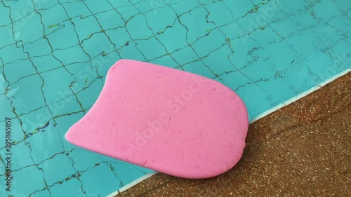 pink swimming board in the swimming pool